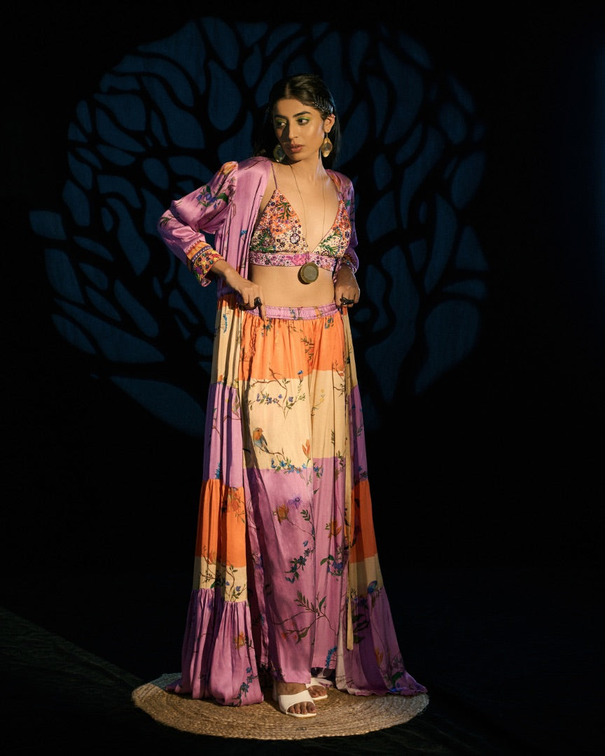 embroidered blouse + printed pants + printed cape