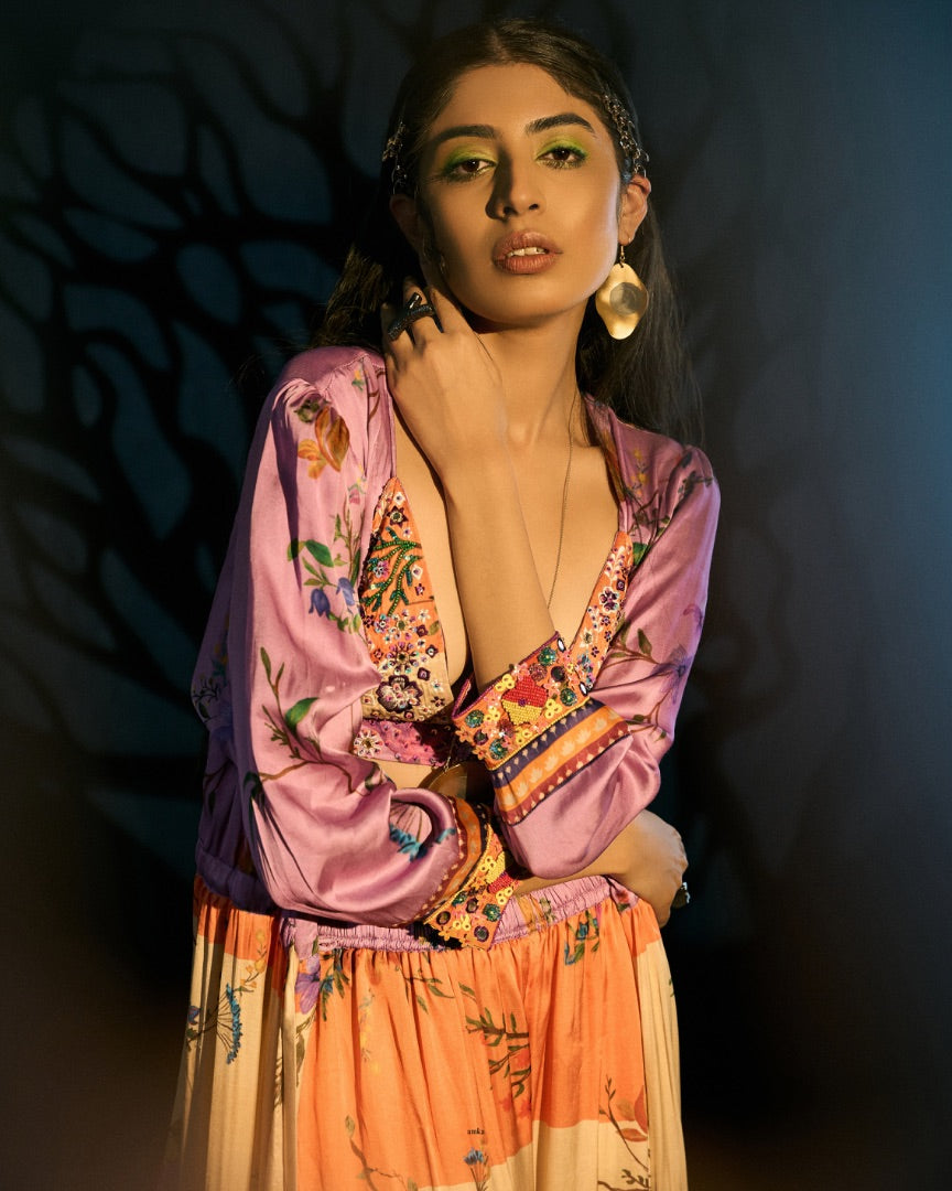 embroidered blouse + printed pants + printed cape