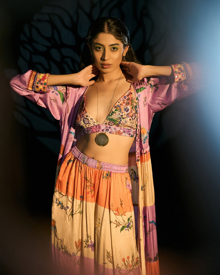 embroidered blouse + printed pants + printed cape